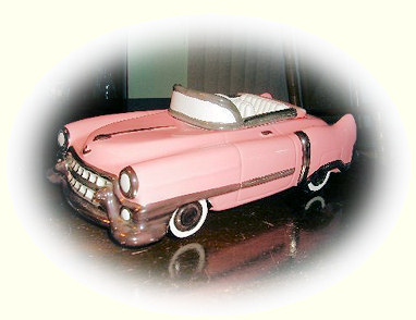 Pink Cadillac toy car.