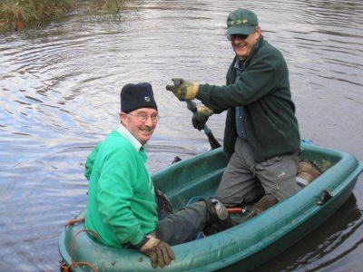 Two old men in a rowboat.