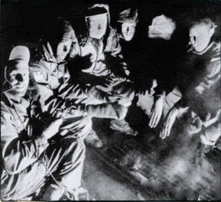 Six freezing men huddled around a dying fire.