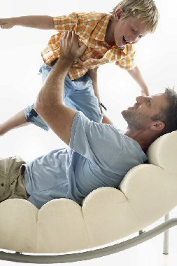 Father holding son in the air - playing.