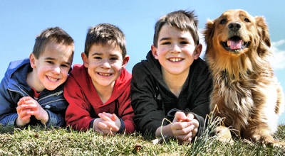 Three boys and a dog.