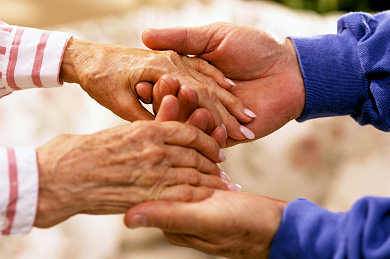 Helping hands, helping and elderly lady.