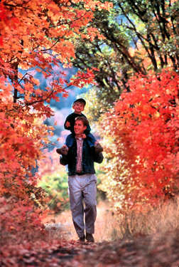 Man and boy enjoying the Fall colors.