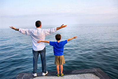 Father and son looking out at the water.</p>
<!---HIDE-ME--->

<div class=