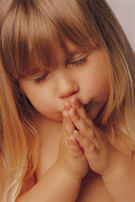 Young girl praying.