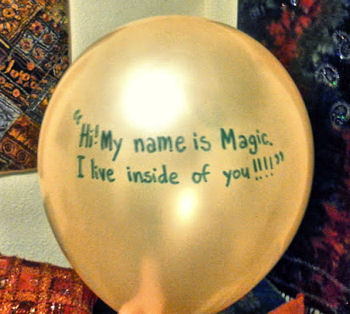 A gold balloon, with the message: My name is magic - I live inside you.