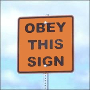 A sign saying: 'Obey This Sign'.