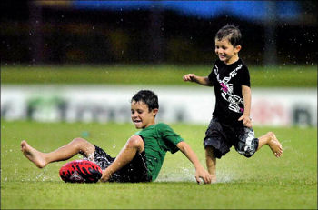 Two Boys Playing in the Rain.</p>
<!---HIDE-ME--->

<div class=