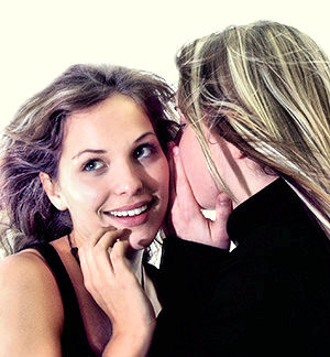 Two women gossiping.