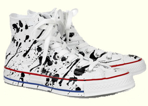 Picture of a pair of sneakers with paint on them.