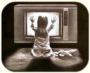 Young girl kneeling in front of the television.